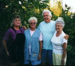 Midge Hey pictured with her husband, daughter and her mother